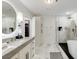Modern bathroom featuring a soaking tub, glass shower, and white marble at 2795 Peachtree Rd # 1305, Atlanta, GA 30305