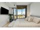 This stylish bedroom boasts floor to ceiling windows and city views that can be enjoyed from the comfort of your bed at 2795 Peachtree Rd # 1305, Atlanta, GA 30305