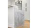 Kitchen island showcasing the sleek gray marble countertop and modern white cabinetry with stainless appliances at 2795 Peachtree Rd # 1305, Atlanta, GA 30305
