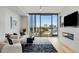 Bright and airy living room with floor-to-ceiling windows, modern furnishings, and city views at 2795 Peachtree Rd # 1305, Atlanta, GA 30305