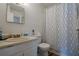 Cozy bathroom with decorative curtain and vanity with ample counter space and storage at 3403 Spring Harbour Drive Dr, Doraville, GA 30340