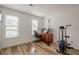 Versatile bedroom with wood floors, natural light, and space for an office or exercise area at 3403 Spring Harbour Drive Dr, Doraville, GA 30340