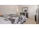Inviting bedroom featuring a decorative bed and neutral decor, and a full length mirror at 3403 Spring Harbour Drive Dr, Doraville, GA 30340