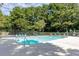Community pool area featuring clear water and surrounding greenery at 3403 Spring Harbour Drive Dr, Doraville, GA 30340