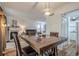 Open dining area with wood floors, seamlessly connected to the living room and kitchen at 3403 Spring Harbour Drive Dr, Doraville, GA 30340
