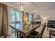 Cozy dining area with wood floors, natural light, and a view of the fireplace at 3403 Spring Harbour Drive Dr, Doraville, GA 30340