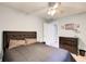 Bedroom with neutral walls, ceiling fan, queen size bed and dark wood dresser at 3531 Evans Ridge Dr, Atlanta, GA 30341