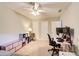 Bright bedroom featuring a ceiling fan, neutral walls and carpet, and space for a computer setup at 3531 Evans Ridge Dr, Atlanta, GA 30341