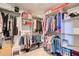 Well-organized walk-in closet with multiple shelves, hanging racks, and shoe storage at 3531 Evans Ridge Dr, Atlanta, GA 30341