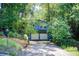 Charming blue home featuring a two-car garage surrounded by lush greenery and a well-manicured lawn at 3531 Evans Ridge Dr, Atlanta, GA 30341