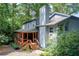 Beautiful exterior view with a well-maintained yard and trees surrounding the home, offering beauty and privacy at 3531 Evans Ridge Dr, Atlanta, GA 30341