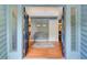 Warm foyer with hardwood floors, bench, and entry into the living room at 3531 Evans Ridge Dr, Atlanta, GA 30341