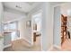 Upstairs hallway with views of the bedroom, an open stairway, and built-in bookshelves at 3531 Evans Ridge Dr, Atlanta, GA 30341