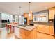 Bright kitchen with stainless steel appliances, stone countertops and a large island with a gas cooktop at 3531 Evans Ridge Dr, Atlanta, GA 30341