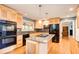 Modern kitchen featuring stainless steel appliances, granite countertops, and hardwood floors, perfect for cooking and gatherings at 3531 Evans Ridge Dr, Atlanta, GA 30341