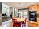 Kitchen with a breakfast area that offers a view of the fireplace, blending cooking and relaxation seamlessly at 3531 Evans Ridge Dr, Atlanta, GA 30341