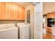 Well-equipped laundry room with washer, dryer, and storage cabinets, making laundry tasks convenient and organized at 3531 Evans Ridge Dr, Atlanta, GA 30341