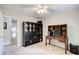 Home office featuring a ceiling fan, natural light, and wood desk with storage at 3531 Evans Ridge Dr, Atlanta, GA 30341