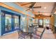 Relaxing screened porch with comfortable seating and ceiling fans, ideal for enjoying the outdoors at 3531 Evans Ridge Dr, Atlanta, GA 30341