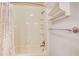 Full shower with neutral tiling, shower caddy, and white shower curtain at 3531 Evans Ridge Dr, Atlanta, GA 30341
