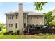 Exterior view of the backyard and deck area with a well-manicured lawn at 6211 Traymore Se Trce, Smyrna, GA 30082