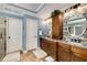 A bathroom featuring a double vanity, granite countertops, and modern lighting at 6211 Traymore Se Trce, Smyrna, GA 30082