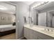 This bathroom features a double vanity with sink and large mirror at 6211 Traymore Se Trce, Smyrna, GA 30082