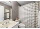 Bathroom featuring modern sink, mirror, and toilet at 6211 Traymore Se Trce, Smyrna, GA 30082