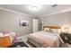 Cozy bedroom features a comfortable bed and modern decor with a chair at 6211 Traymore Se Trce, Smyrna, GA 30082