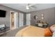 Bedroom featuring desk, ceiling fan, and connecting bathroom at 6211 Traymore Se Trce, Smyrna, GA 30082