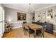 Elegant dining room featuring a wooden table, vintage art, and a decorative light fixture at 6211 Traymore Se Trce, Smyrna, GA 30082