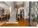 Grand foyer with hardwood floors, a staircase featuring iron railings, and views into adjoining living areas at 6211 Traymore Se Trce, Smyrna, GA 30082
