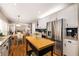Open-concept kitchen and dining area with white cabinets and stainless steel appliances at 6211 Traymore Se Trce, Smyrna, GA 30082