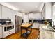 Well-equipped kitchen with stainless steel appliances, custom island, and granite countertops at 6211 Traymore Se Trce, Smyrna, GA 30082