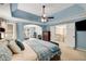 Spacious main bedroom with tray ceiling and doorway to additional room at 6211 Traymore Se Trce, Smyrna, GA 30082