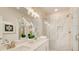 Bright bathroom with double sinks, modern lighting, and marble tiled glass shower at 1240 Oakland Sw Ter # B, Atlanta, GA 30310