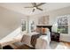 Bedroom with a ceiling fan, multiple windows, and a plush queen bed at 1240 Oakland Sw Ter # B, Atlanta, GA 30310