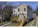 Exterior elevation of home with wooden deck and stairs at 1240 Oakland Sw Ter # B, Atlanta, GA 30310