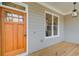 Close-up of the front porch showcasing the wood door and stylish exterior at 1240 Oakland Sw Ter # B, Atlanta, GA 30310