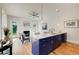 Open concept kitchen and living room with stainless steel appliances, large island, and hardwood floors at 1240 Oakland Sw Ter # B, Atlanta, GA 30310