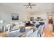 Spacious living room featuring stainless steel appliances, quartz countertops, and open concept to dining area at 1240 Oakland Sw Ter # B, Atlanta, GA 30310