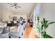 Spacious open-concept living area flowing into a modern kitchen and featuring gleaming hardwood floors throughout at 1240 Oakland Sw Ter # B, Atlanta, GA 30310