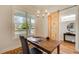 Charming office space with a sliding barn door, wood floors, stylish chandelier and ample natural light at 1240 Oakland Sw Ter # B, Atlanta, GA 30310