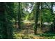 Picturesque backyard view through the trees, showcasing the natural beauty of the property at 1240 Oakland Sw Ter # B, Atlanta, GA 30310