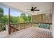 This large back porch features a swing and ceiling fan perfect for relaxing outdoors at 130 White Sands Ct, Suwanee, GA 30024