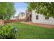 Level backyard features lush green grass and a white exterior home at 130 White Sands Ct, Suwanee, GA 30024