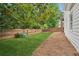 Spacious backyard with a well-maintained lawn and a privacy fence, perfect for outdoor activities and relaxation at 130 White Sands Ct, Suwanee, GA 30024