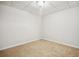 Cozy bedroom with neutral carpet, clean, neutral colored walls and base trim at 130 White Sands Ct, Suwanee, GA 30024