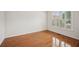 Bright bedroom with hardwood floors, natural light, and minimalist design at 130 White Sands Ct, Suwanee, GA 30024