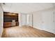 Bedroom featuring hardwood floors, a built-in bookshelf and desk, and neutral paint at 130 White Sands Ct, Suwanee, GA 30024